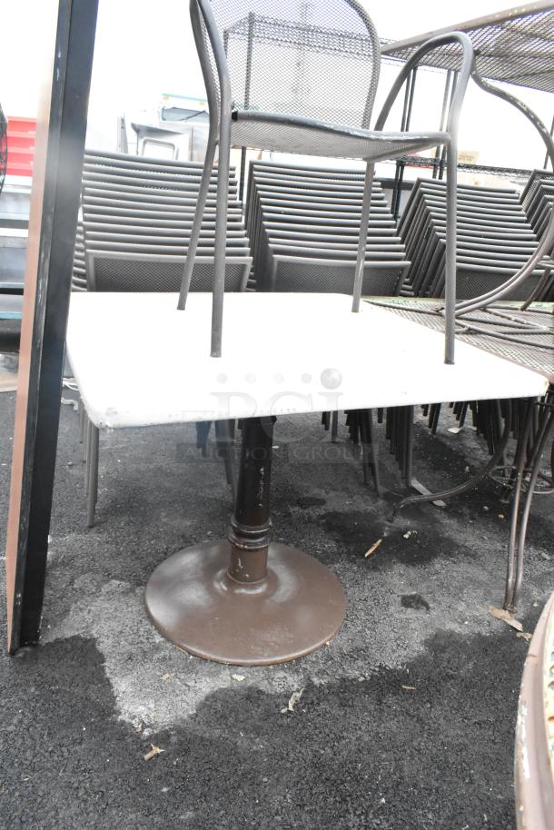 Dining height chair and table atop a folding table, metal frame design, durable construction. Multiples available at auction.