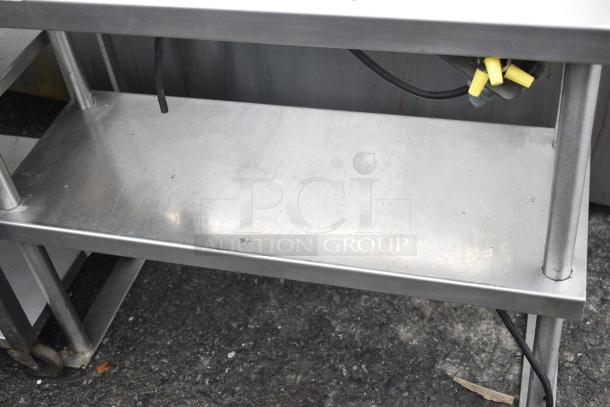 Commercial 2-tier stainless steel over shelf with Hatco GRA-24 warming strip, in used condition, visible wiring included.