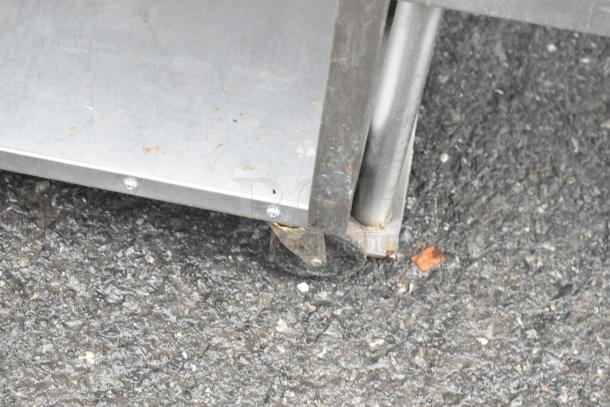 Commercial 3 Tier Cart with sturdy metal shelves and durable casters for easy mobility, showing minor wear.