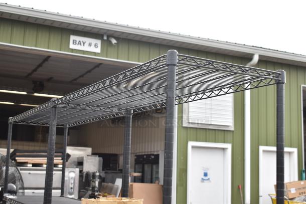 Black finish 3-tier wire shelving unit in used condition. Buyer must dismantle for shipping. Located in front of Bay #6.