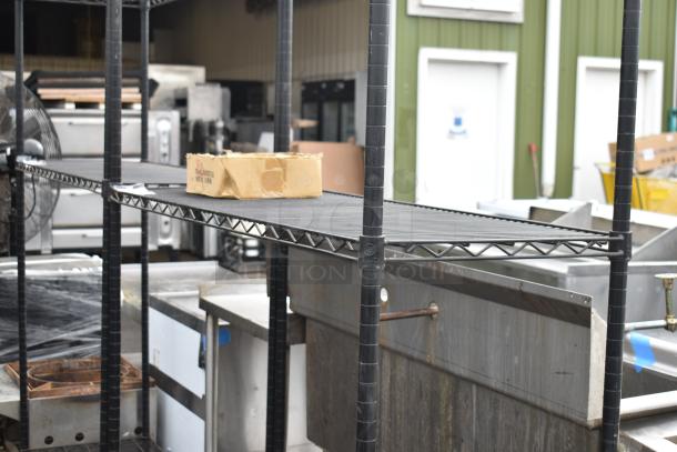 Black finish 3-tier wire shelving unit in used condition, requiring buyer dismantlement and freight considerations.