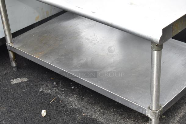 Commercial equipment stand with under shelf, stainless steel, good condition, sturdy build, ideal for kitchen use.