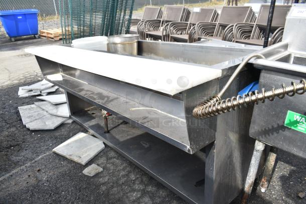 Commercial Steam Table, stainless steel, used condition. Features storage shelf, adjustable controls, and stainless fixtures.