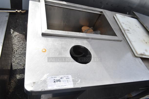 Commercial stainless steel prep station with under shelves, includes sink area and hole for waste disposal, used condition.