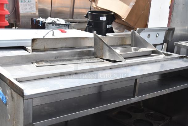 Commercial soda station with under shelf, stainless steel construction, integrated trays, and spout. Used condition.