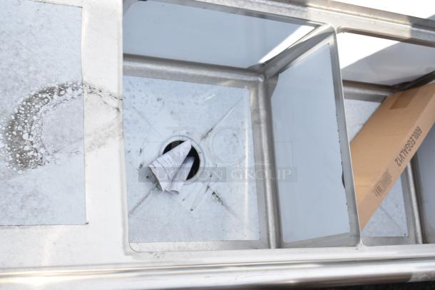 Brand new Steelton 522CS31818LR 90" stainless steel three-compartment sink, 18-gauge, with two drainboards. Scratch and dent condition.