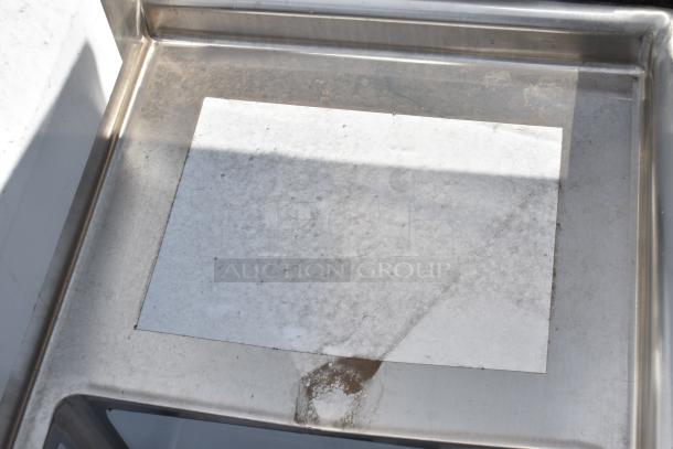 Steelton 522CS31818LR 90", 18-gauge stainless steel, commercial sink corner with scratches, three compartments.