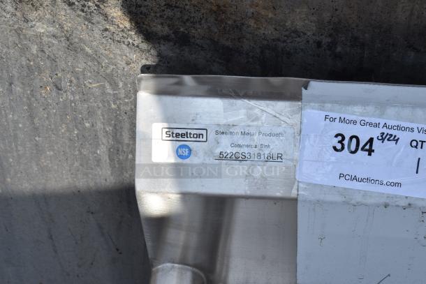 Brand new Steelton 522CS31818LR 90" stainless steel commercial sink, 18-gauge, three compartments, two drainboards. Tags show model and NSF certification.
