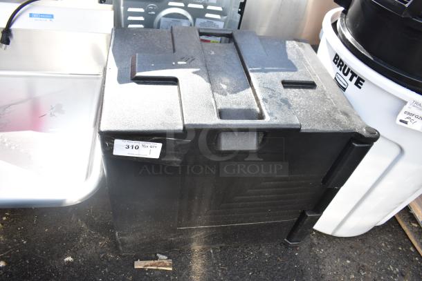 Brand new black poly catering case, slightly scratched, with top handles. Auction label shows item 310.