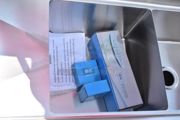 Brand new BK Resources BKS-2-18-12-18T 2 Bay Sink, scratch and dent, no legs, includes dual drain boards, visible packaging.