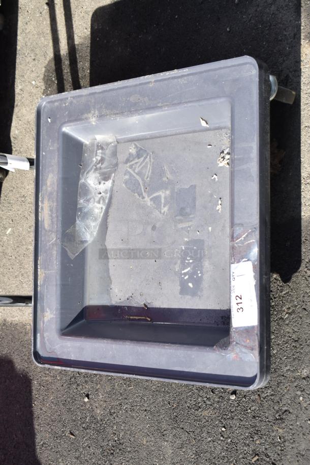 Plastic dolly with handle on commercial casters, used condition, surface wear visible, label stating "312."