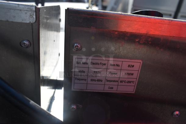 Countertop electric fryer with 2 bays, includes 2 metal fry baskets and lids. Operates at 110 volts, 1 phase.