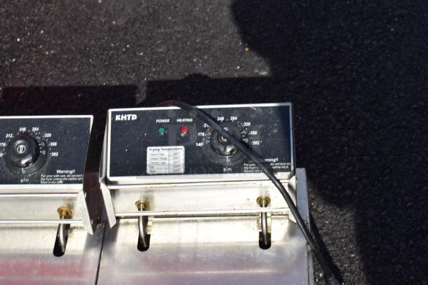 Countertop electric 2-bay fryer with 2 fry baskets and lids, 110 volts, 1 phase, temperature controls visible.