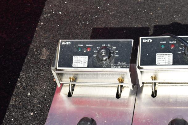 Countertop dual-bay electric fryer with two metal baskets and lids. KHTD model. Voltage: 110V, single-phase. Temperature settings labeled.