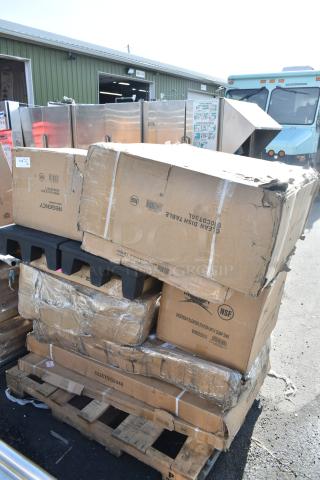 Stack of boxes labeled Regency, showing signs of damage. Boxes contain new dish and work tables. NSF and model numbers visible.