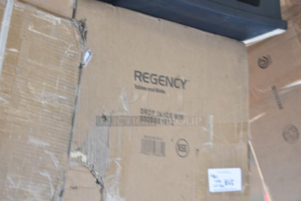 Cardboard box labeled "Regency Tables and Sinks." Boxes include scratch and dent items like a dish table and work table.