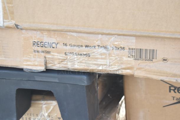 "Regency 16 Gauge Work Table, 18x36 inches, in box, visible barcodes and markings, part of 10 new scratch and dent items."