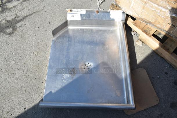 Commercial right side clean side dish table with added drain holes, no legs, slight wear visible.