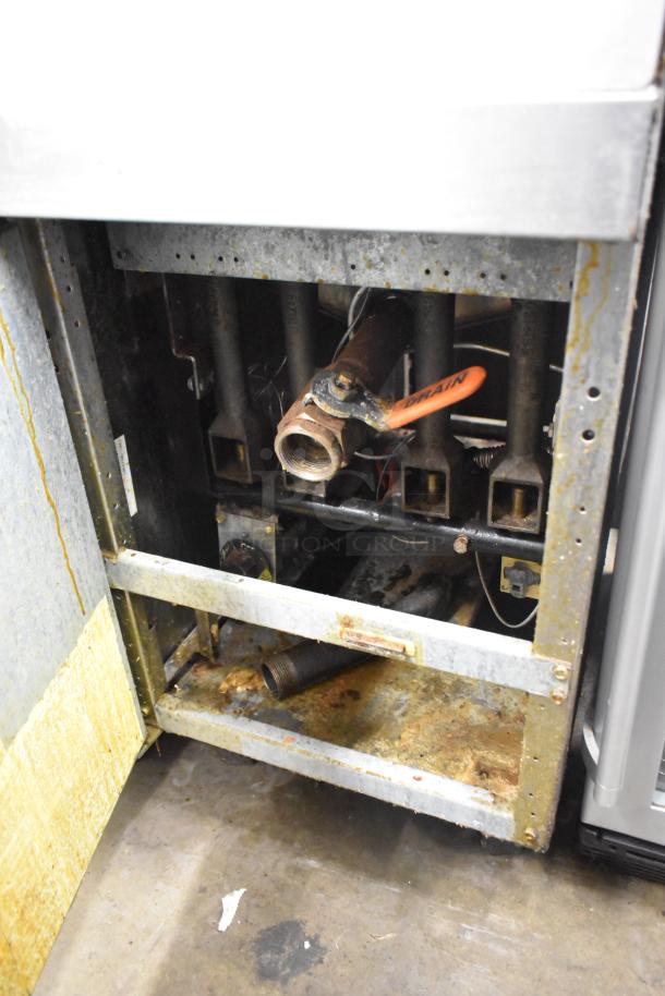 Dean Commercial Floor Style Deep Fat Fryer, showing the interior with visible pipes and valves, worn condition, for auction.