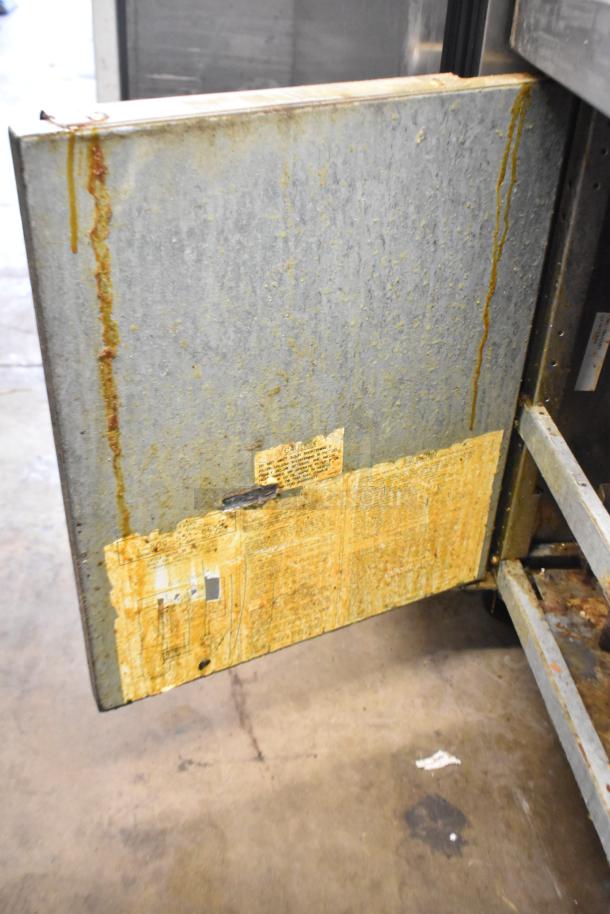 Dean Commercial Floor Style Deep Fat Fryer, showing worn exterior condition and grease marks, with faded labels on the side.