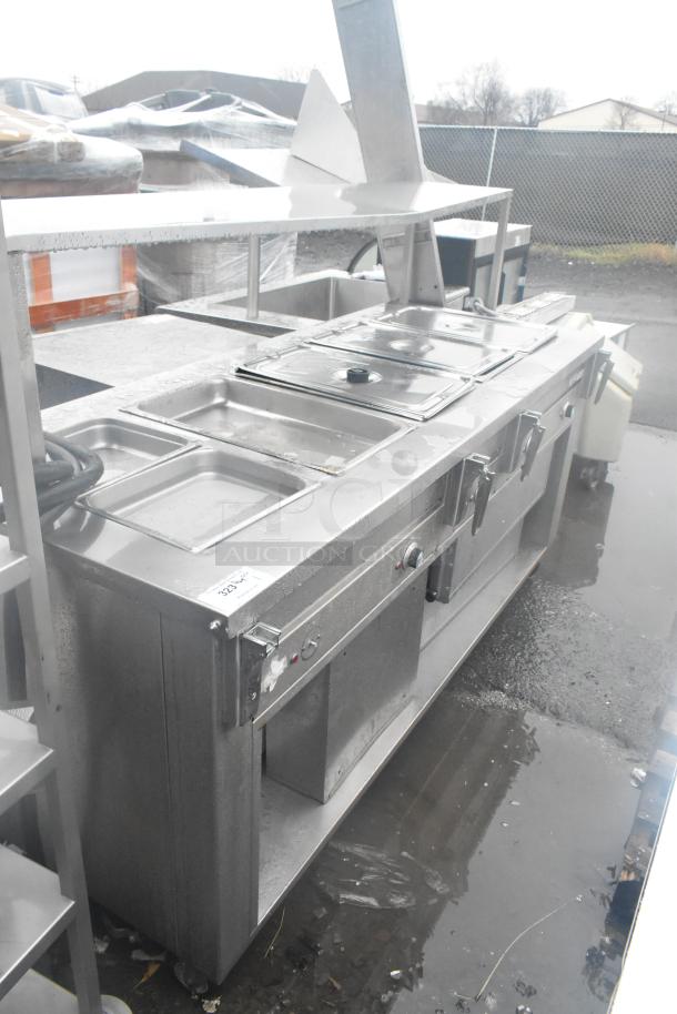 Dinex DHF6 steam table, commercial-grade, with over and under shelf. 208 Volts, stainless steel, good condition.
