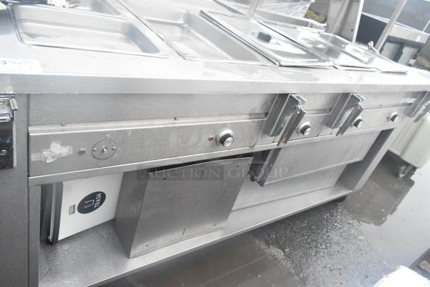 Dinex DHF6 commercial steam table with over and under shelf, 208 volts, stainless steel, used condition.