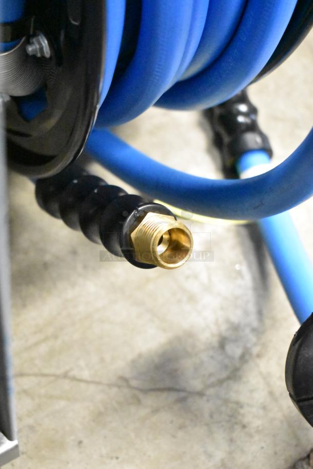 Brand new Regency open powder-coated steel air/water hose reel with blue hose, featuring brass connector. Slight scratch and dent.