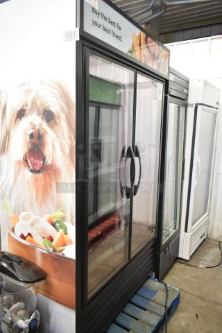 2022 True TVM-48SL-HC commercial 2-door cooler merchandiser, 115V, 1 phase, glass doors, pet-themed exterior graphics.