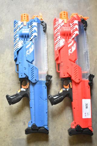 Two Nerf Rival toy guns in blue and red, good condition, featuring tactical designs. Auction tag reads "326, QTY 2."
