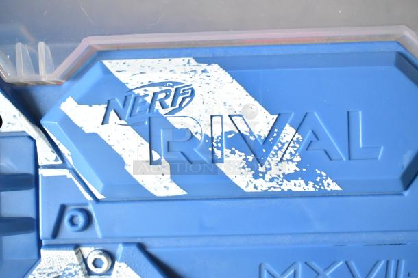 Blue Nerf Rival toy gun detail, featuring bold logo and striped pattern. Ideal for collectors or Nerf enthusiasts.