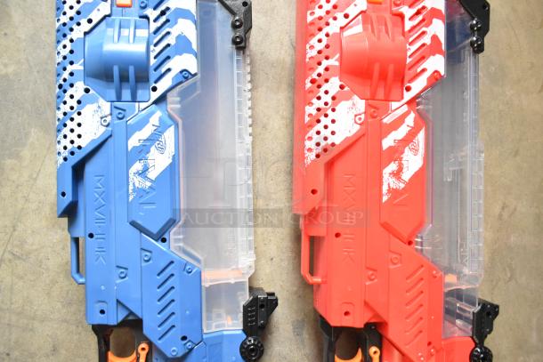 Two Nerf Rival toy guns, one blue and one red. Visible Rival branding. Both in good condition.