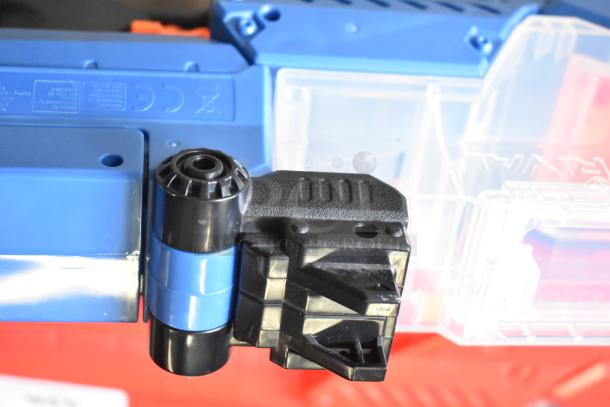 Blue Nerf Rival toy gun with visible attachments and markings, in excellent condition.