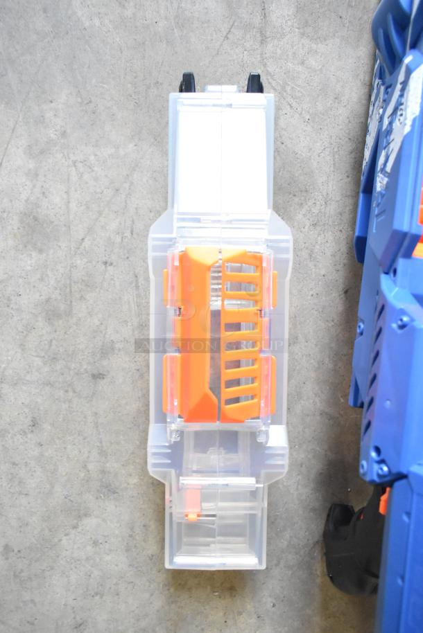 Two Nerf Rival toy guns, featuring blue and orange design, shown in excellent condition on a concrete surface.