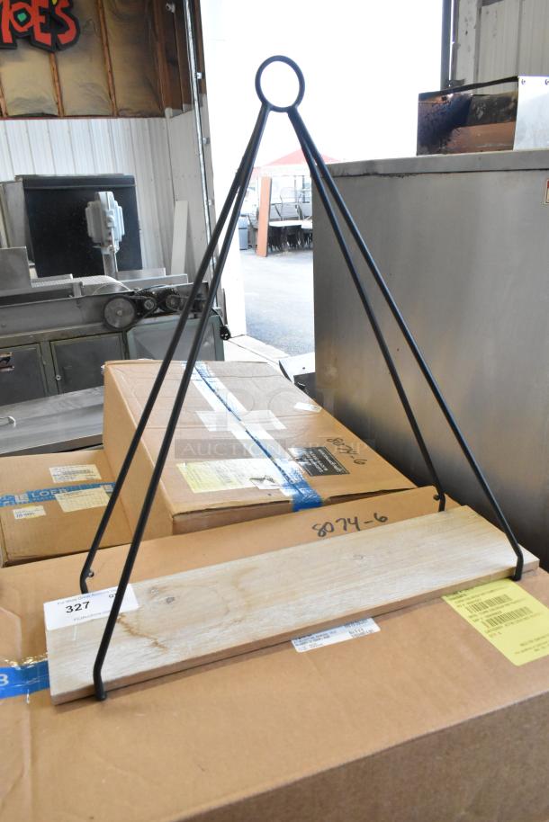 Triangular metal stand with a wooden base, in good condition. Auction tag labeled "327" visible.