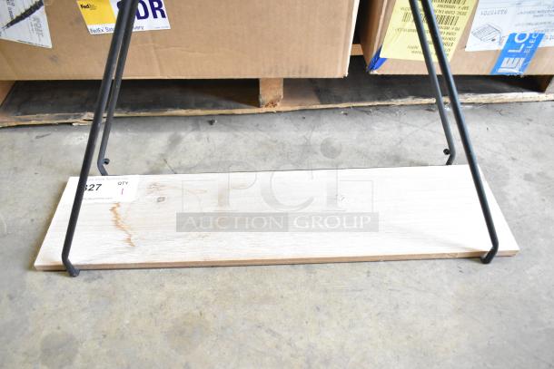 Industrial-style wooden stand with black metal frame, featuring a natural wood grain finish. Auction tag labeled "Lot 827".