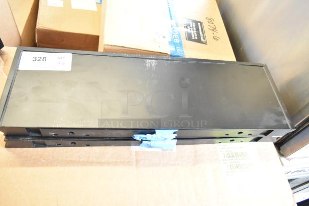 Black metal shelves, set of two, shown stacked. Condition appears new. Label states "328 QTY x2" for auction.