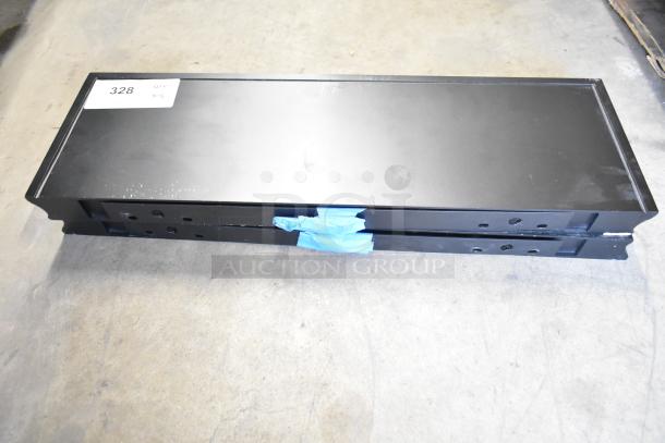 Black metal shelves in stack, taped together. Auction lot tag 328 shows quantity of two. Good condition.