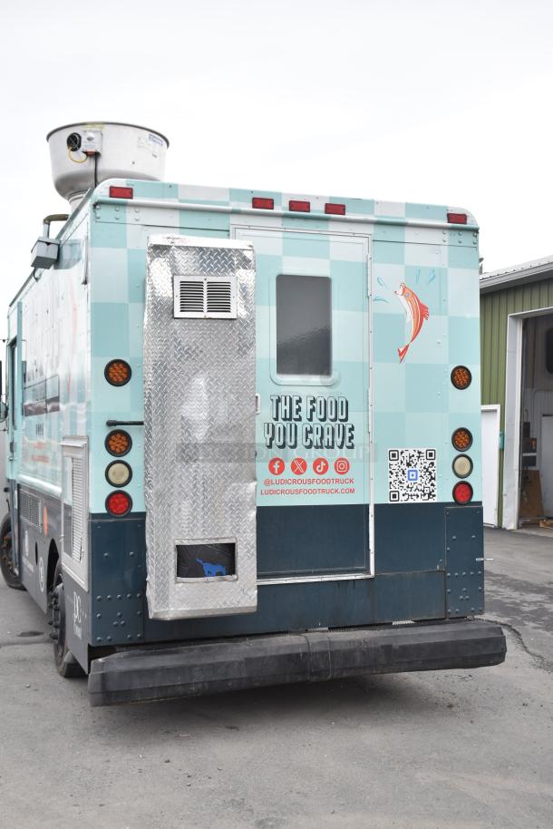 Freightliner Ludicrous food truck with signage, propane hookup, grease hood, fryer, griddle, grill, refrigeration, and serving window.