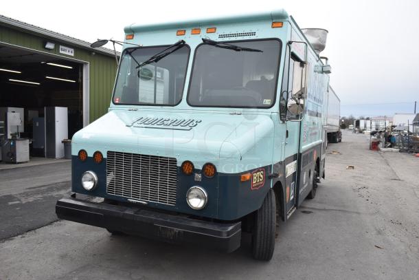 Freightliner Ludicrous Food Truck with propane hookup, grease hood, fryer, griddle, grill, refrigeration, and serving window.