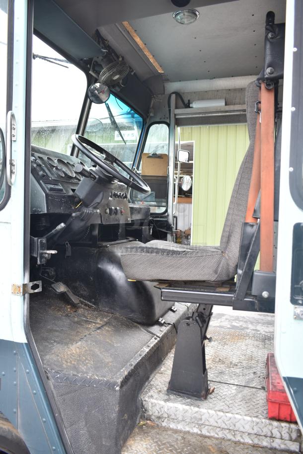 Freightliner Ludicrous Food Truck interior showing driver's seat, steering wheel, and dashboard in used condition.