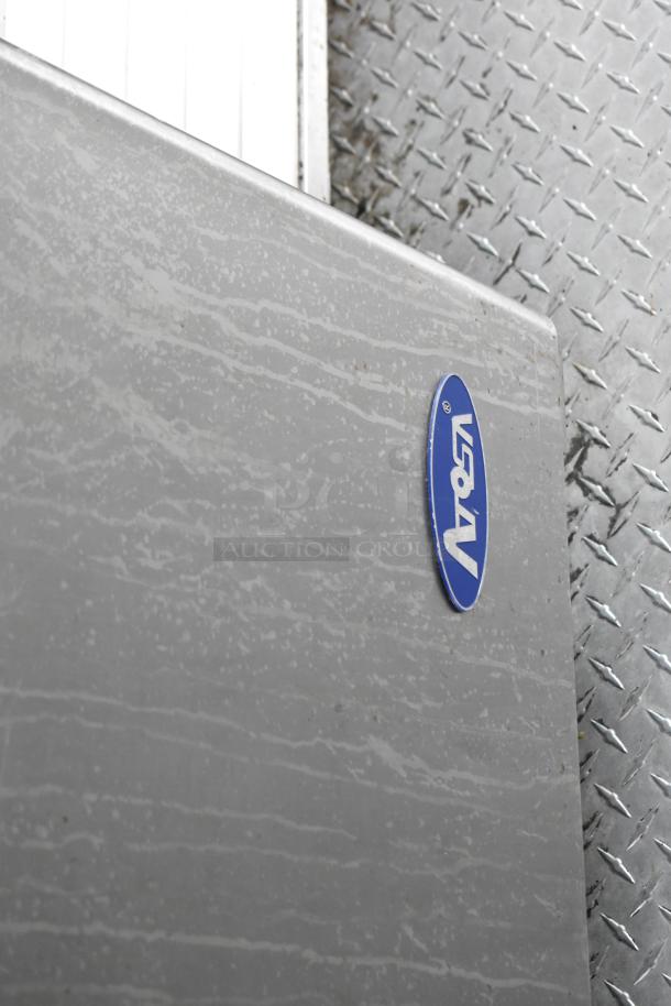 Freightliner food truck exterior showing a metal surface with a blue logo. Condition appears used.