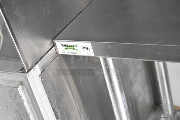 2002 Freightliner Ludicrous Food Truck features Regency stainless steel table with NSF certification label.