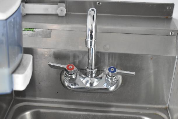 2002 Freightliner Food Truck stainless steel sink with dual faucet controls, part of a fully equipped mobile kitchen.
