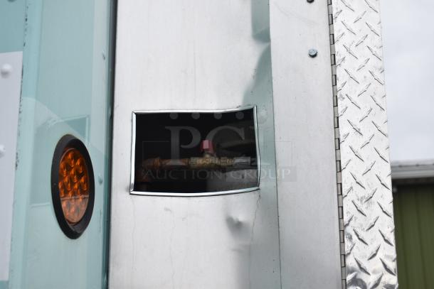 2002 Freightliner Ludicrous food truck exterior, showing propane hookup and side light, metal panels with visible wear.