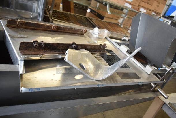 Lenin gas-powered chip fryer with conveyor, 220,000 BTU. Commercial casters, metal construction, good condition.