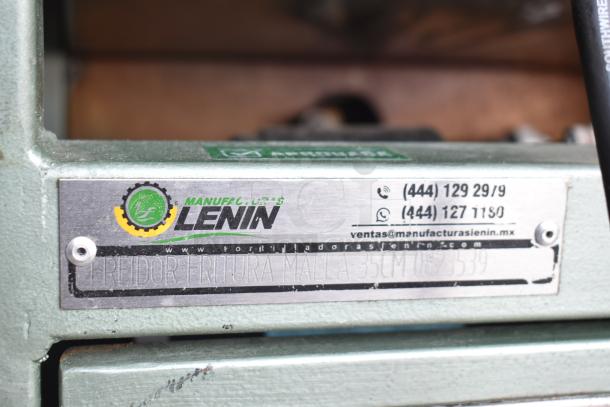 Lenin commercial gas chip fryer with conveyor, 220,000 BTU, on casters. Manufacturer label with contact info visible.