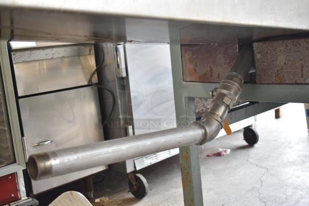 Lenin commercial gas-powered chip fryer conveyor with 220,000 BTU, on casters. Features visible piping and metal base.