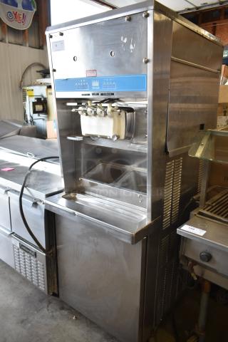 Taylor S757-33 commercial soft serve ice cream machine, 2 flavor with twist, floor style, 208-230 volts, 3 phase, stainless steel finish.