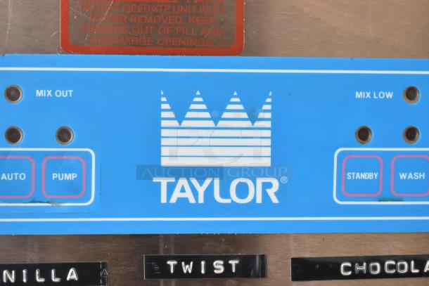 Taylor S757-33 soft serve machine controls with blue panel and logo. Features auto, pump, standby, wash buttons.