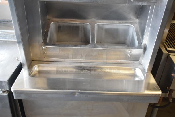 Taylor S757-33 commercial soft serve ice cream machine, 2 flavor with twist. Stainless steel, 208-230V, 3 phase, used condition.